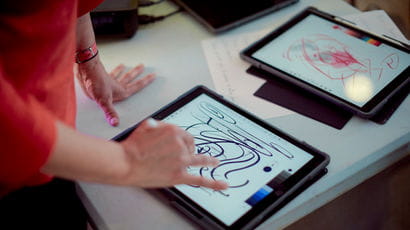 Person using tablet for art