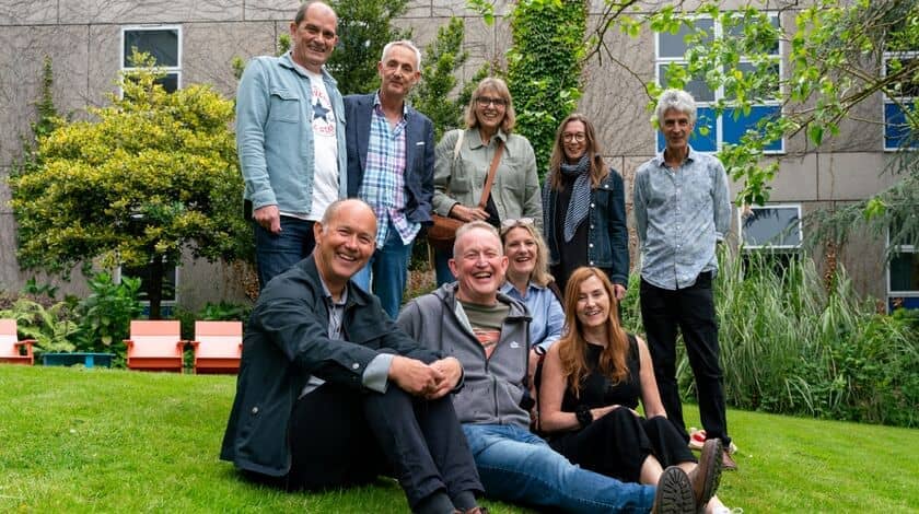Group of students posing for a reunion photo