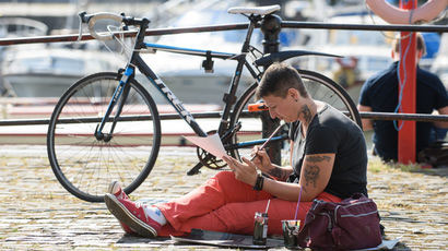 Student sketching on the harbourside in Bristol.