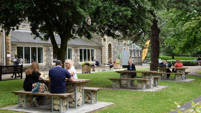 People sat on benches on Glenside Campus.