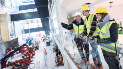 Group of builders working on campus.