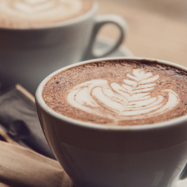 Two cups of coffee in a cafe