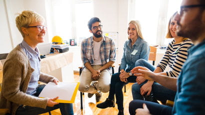 People sat in a room in a therapy setting.