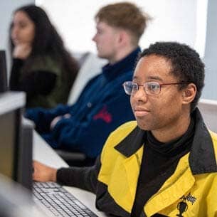 Student looking at a computer.