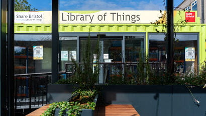The Library of Things at UWE Bristol A picture of the Library of Things, which is in a green shipping container and has tables with plants on outside it.