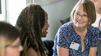 Member of staff working with students