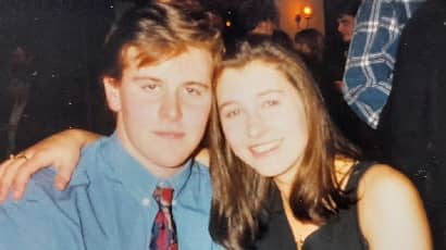 Young couple posing for photo.