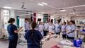 A group of adult nursing students gathering to listen to their programme leaders.