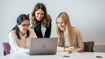 CPD students sat in a group looking at a laptop