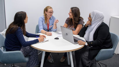 Business partners talking around a table