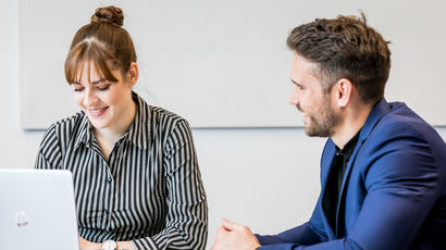 Employees engaged in a business meeting