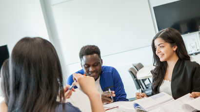 Group of black, Asian and minority ethnic students working around a table