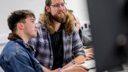 A design student consulting with a client on a project.