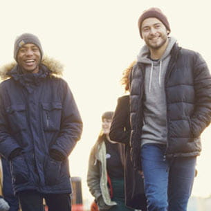 Students walking on harbourside in Bristol.