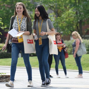 Visitors to an Open Day walking on Frenchay Campus.