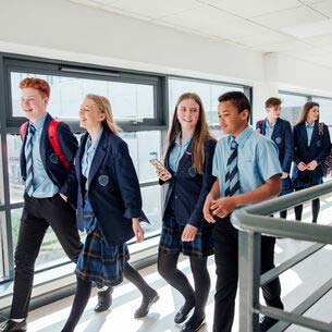 School students walking along a corridor