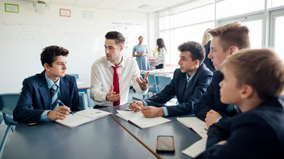 A group of students working in a classroom