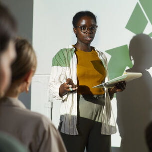 An environmental science expert giving a talk at an eco conference.