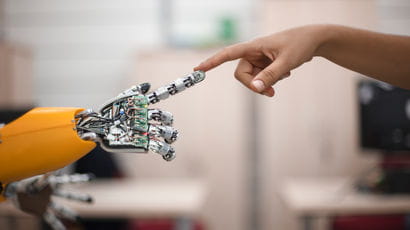 Human finger touching robot finger