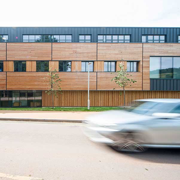 Building at Bower Ashton with a car driving past