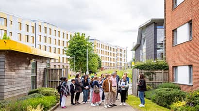 A group of people take a tour around Purdown View on Frenchay Campus.