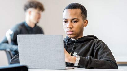 Student looking at a laptop