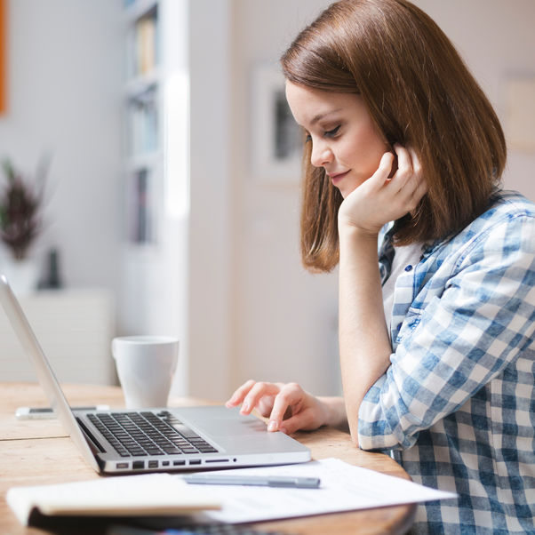 A female checking her results on her laptop