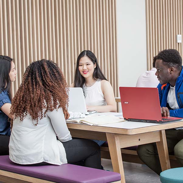 A group of students studying together in the Business School.