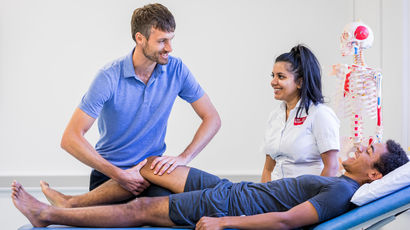 Apprentice physiotherapist in action