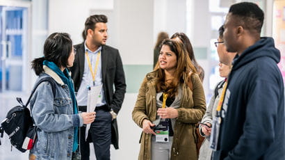 A group of students chatting in a group