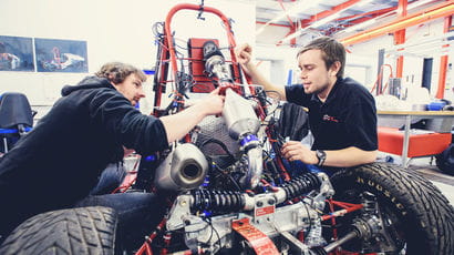 Two students working on an engineering project