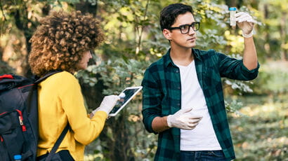 Two students exploring the environment