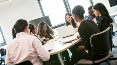 A group of students sat around a table