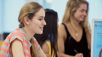 Students sat in a library.