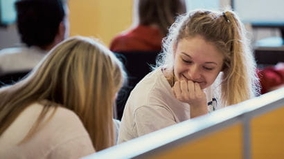 Two students working together in Frenchay library.