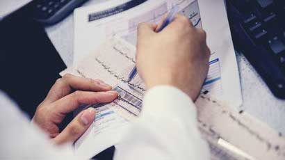 Students looking at a patients notes