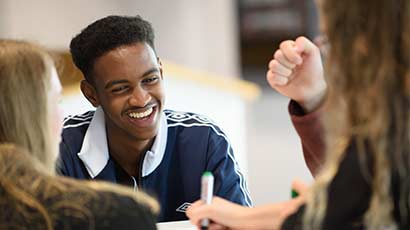 Some students sat around a table, doing group work.