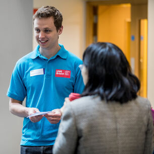A UWE representative talks to an offer holder.