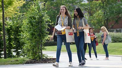 Students walking around campus on an Open Day.