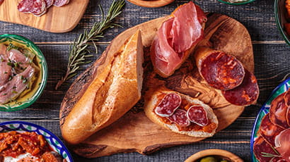 A table lay showing meat-based tapas.