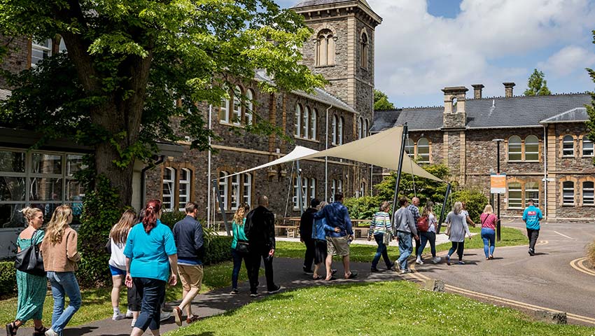 Open day visitors walking outside Glenside Campus.