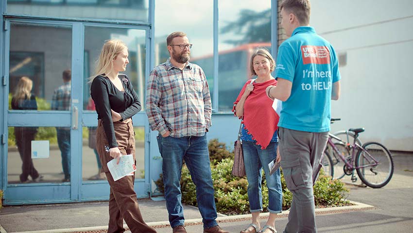 Student ambassador talking to open day visitors