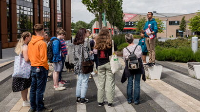 A group of prospective students and their parents and supporters listening  to UWE Bristol representative speak.