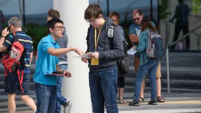 A student ambassador helping an Open Day attendee.