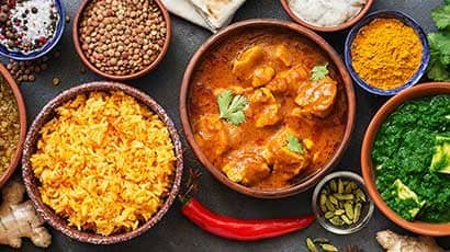 Aerial view of indian ingredients in bowls on a table.