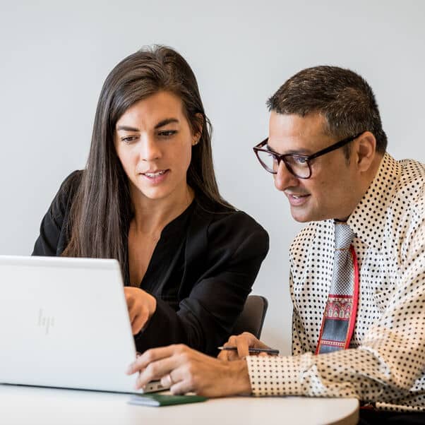Two professionals engaging in a continuing development lecture.