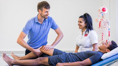 Students practicing using equipment for sports rehabilitation