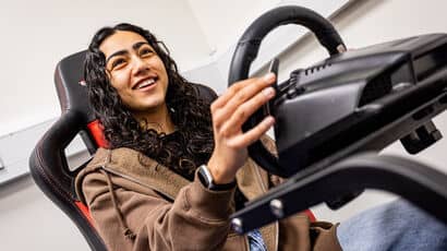 Psychology student in a driving simulator