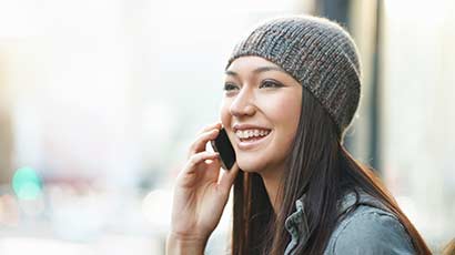 A female having a conversation on her smartphone