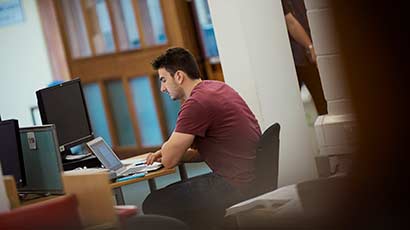 A young male on his laptop